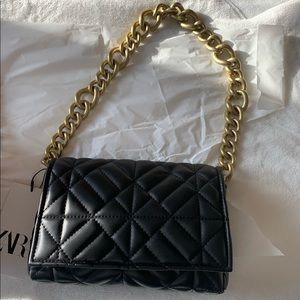 Black Zara bag with gold hardware.